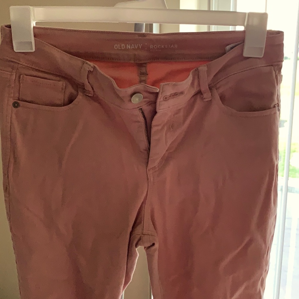 Distressed pink jeans